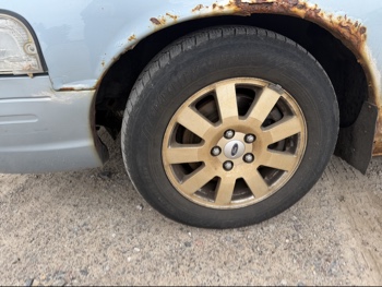 2007 ford crown-victoria lx with 175864 miles for sale near elk-river, minnesota 106403_12_drv_front_wheel.jpg
