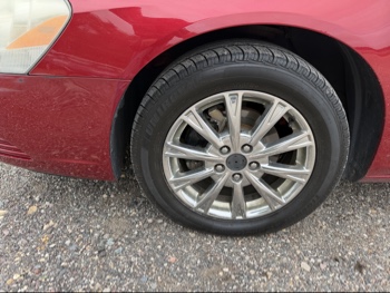 2009 buick lucerne cxl1 with 214213 miles for sale near elk-river, minnesota 106412_12_drv_front_wheel.jpg