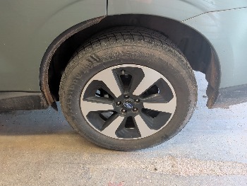 2017 subaru forester 2.5i-premium-pzev-cvt with 119029 miles for sale near elk-river, minnesota 106413_13_rear_drv_wheel.jpg