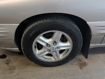 1997 pontiac bonneville se with 97947 miles for sale near elk-river, minnesota 106415_12_drv_front_wheel.jpg