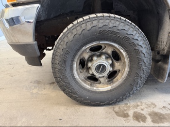 2002 ford f-250-sd with 205001 miles for sale near elk-river, minnesota 106433_12_drv_front_wheel.jpg