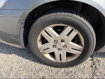 2006 chevrolet impala with 107595 miles for sale near elk-river, minnesota 106444_12_drv_front_wheel.jpg