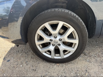 2013 nissan rogue s-awd with 108328 miles for sale near elk-river, minnesota 106488_12_drv_front_wheel.jpg