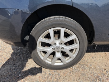 2013 nissan rogue s-awd with 108328 miles for sale near elk-river, minnesota 106488_14_rear_pass_wheel.jpg