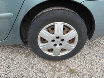 2007 toyota corolla with 80829 miles for sale near elk-river, minnesota 106497_13_rear_drv_wheel.jpg