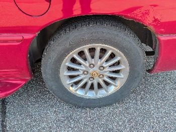 1999 chrysler town-and-country limited-fwd with 88290 miles for sale near elk-river, minnesota 106499_13_rear_drv_wheel.jpg