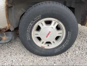 2002 gmc yukon-xl 1500-4wd with 148627 miles for sale near elk-river, minnesota 106511_13_rear_drv_wheel.jpg