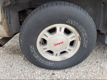 2002 gmc yukon-xl 1500-4wd with 148627 miles for sale near elk-river, minnesota 106511_14_rear_pass_wheel.jpg