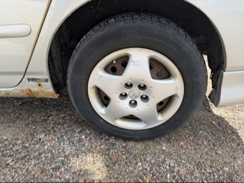 2003 toyota corolla ce with 248006 miles for sale near elk-river, minnesota 106529_13_rear_drv_wheel.jpg