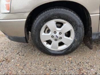 2004 ford freestar lx-sport with 163395 miles for sale near elk-river, minnesota 106532_12_drv_front_wheel.jpg