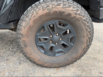 2016 jeep wrangler unlimited-sahara-4wd with 91724 miles for sale near Elk River, Minnesota 106578_13_rear_drv_wheel.jpg