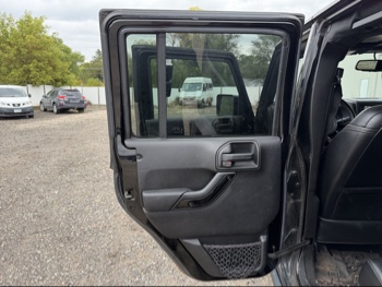 2016 jeep wrangler unlimited-sahara-4wd with 91724 miles for sale near Elk River, Minnesota 106578_25_drv_rear_door_panel.jpg