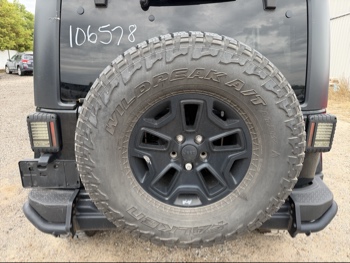 2016 jeep wrangler unlimited-sahara-4wd with 91724 miles for sale near Elk River, Minnesota 106578_27_spare_tire.jpg