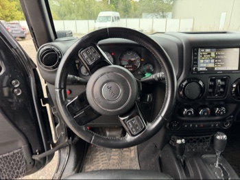 2016 jeep wrangler unlimited-sahara-4wd with 91724 miles for sale near Elk River, Minnesota 106578_33_dash_from_driver.jpg