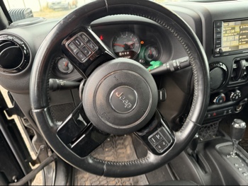 2016 jeep wrangler unlimited-sahara-4wd with 91724 miles for sale near Elk River, Minnesota 106578_36_steering_wheel.jpg