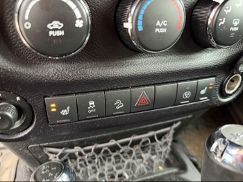 2016 jeep wrangler unlimited-sahara-4wd with 91724 miles for sale near Elk River, Minnesota 106578_42_heated_seat_switches.jpg