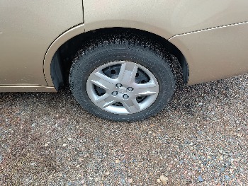 2006 saturn ion with 93338 miles for sale near Elk River, Minnesota 106579_13_rear_drv_wheel.jpg