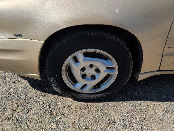 2004 pontiac grand-am se1-sedan with 91565 miles for sale near Elk River, Minnesota 106619_12_drv_front_wheel.jpg