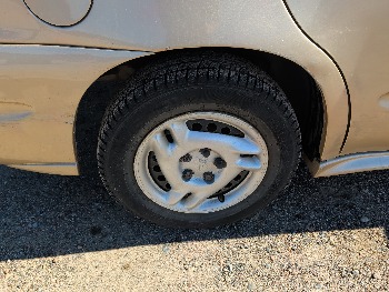 2004 pontiac grand-am se1-sedan with 91565 miles for sale near Elk River, Minnesota 106619_14_rear_pass_wheel.jpg