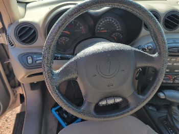 2004 pontiac grand-am se1-sedan with 91565 miles for sale near Elk River, Minnesota 106619_36_steering_wheel.jpg