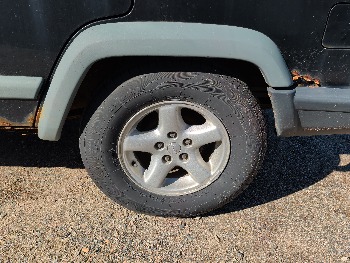 1998 jeep cherokee sport-4-door-4wd with 185611 miles for sale near Elk River, Minnesota 106637_13_rear_drv_wheel.jpg