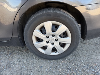 2011 toyota camry base-6-spd-at with 219492 miles for sale near Elk River, Minnesota 106639_13_rear_drv_wheel.jpg