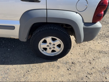 2005 jeep liberty sport-4wd with 175646 miles for sale near Elk River, Minnesota 106643_13_rear_drv_wheel.jpg