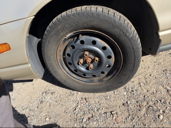 2002 saturn sl sl1 with 170974 miles for sale near Elk River, Minnesota 106660_12_drv_front_wheel.jpg