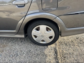 2003 toyota echo 4-door-sedan with 222883 miles for sale near Elk River, Minnesota 106664_13_rear_drv_wheel.jpg