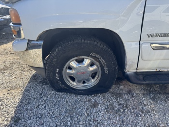 2002 gmc yukon 4wd with 268752 miles for sale near Elk River, Minnesota 106679_12_drv_front_wheel.jpg