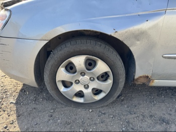 2007 kia spectra lx with 188719 miles for sale near Elk River, Minnesota 106695_12_drv_front_wheel.jpg