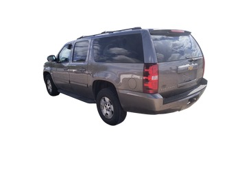 2013 chevrolet suburban ltz-1500-4wd with 215158 miles for sale near elk-river, minnesota 106563_03_rear_driver_corner.jpg